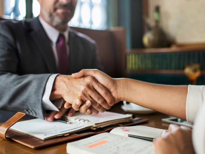 two people shaking hands